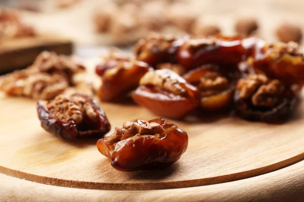 Close-up of walnuts, date fruits — Stock Photo, Image