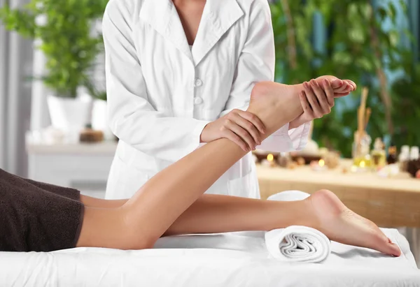 Woman relaxing with leg massage — Stock Photo, Image