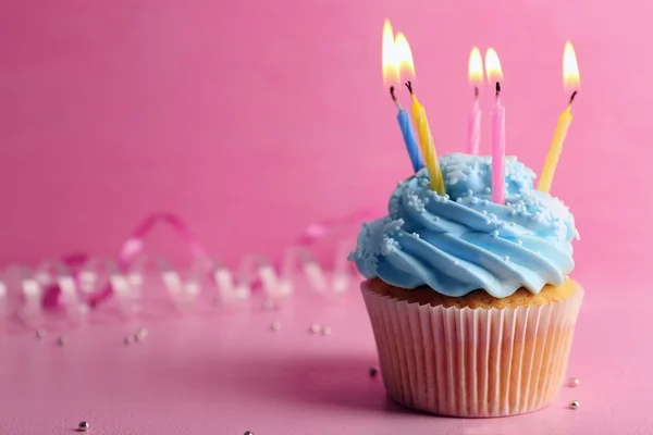 Cupcake decorated with candles — Stock Photo, Image