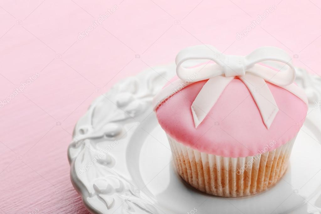 Tasty cupcake with bow