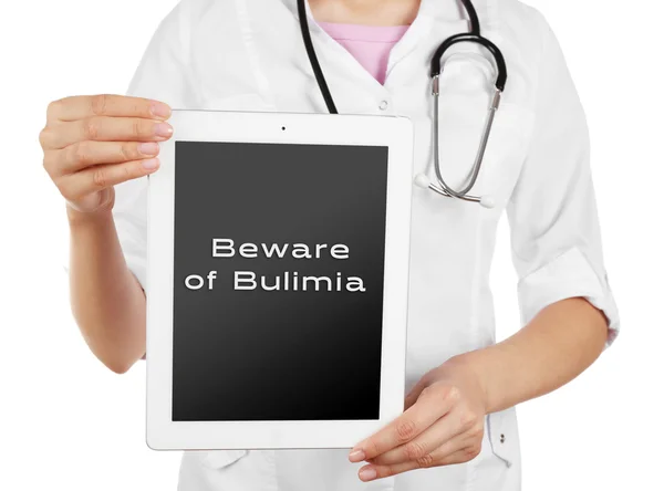 Arts met tablet pc en tekst Beware van boulimia — Stockfoto