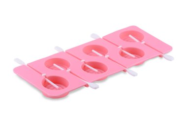 Beyaz arka planda izole edilmiş pembe silikon form. Lolipop kapları, silikon kalıplar, fırın kapları..