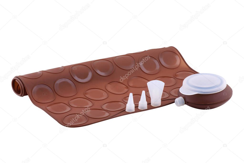 Brown silicone baking mat for macaroons isolated on white background, copy space. Clipping path