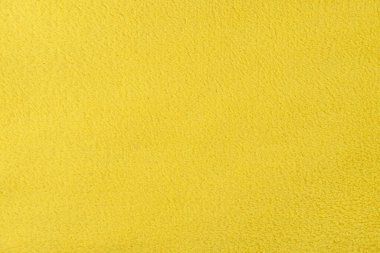 Sarı yün halı dokusu arka plan, kopyalama alanı. Aydınlatıcı. 2021 yılının rengi. Üst manzara, düz uzanma
