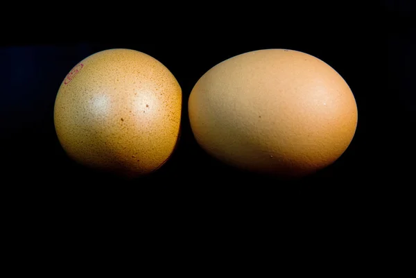 Eggs isolated on black background — Stock Photo, Image