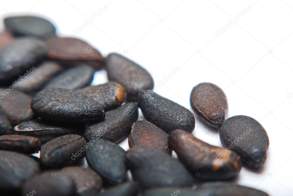 Pile of black sesame seeds isolated on white background