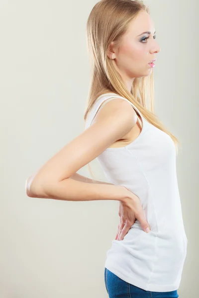 Backache. Young woman suffering from back pain — Stock Photo, Image