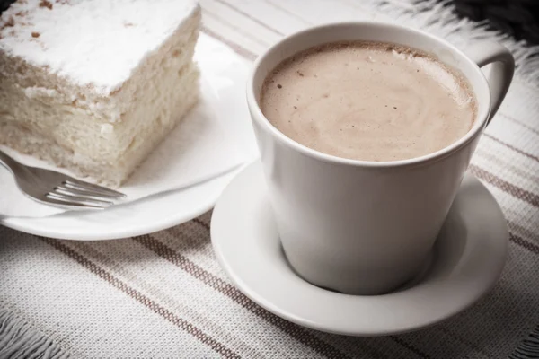 Cup with coffee and cake on table — Stock Photo, Image