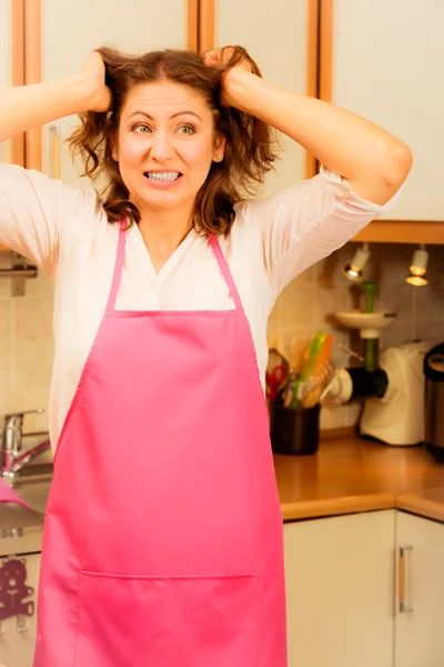 Unhappy housewife in kitchen — Stock Photo, Image