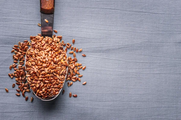 Flax seeds linseed on kitchen spoon — Stock Photo, Image