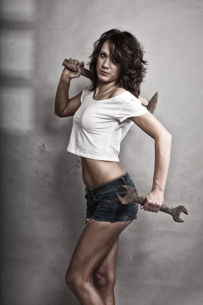 Sexy girl holding hammer — Stock Photo, Image