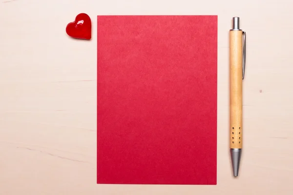 Blank sheet of paper heart and pen on table — Stock Photo, Image