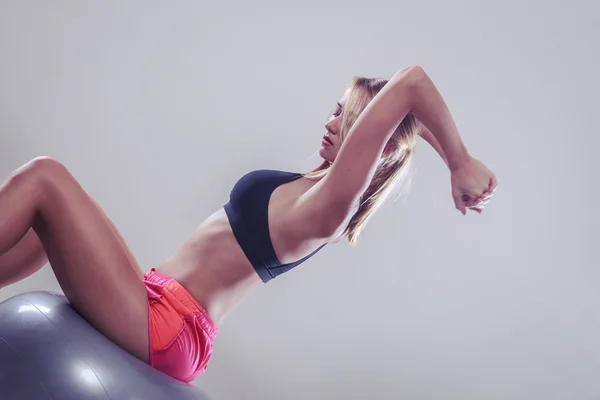 Woman doing fitness exercises with fit ball — Stock Photo, Image