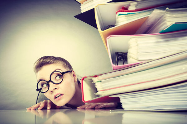 Accountant terrified of pils of binders.