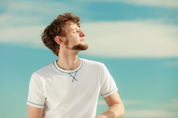 Man with closed eyes relaxing breathing fresh air. — Stock Photo, Image