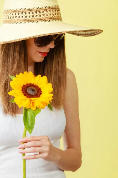Attractive woman with sunflower