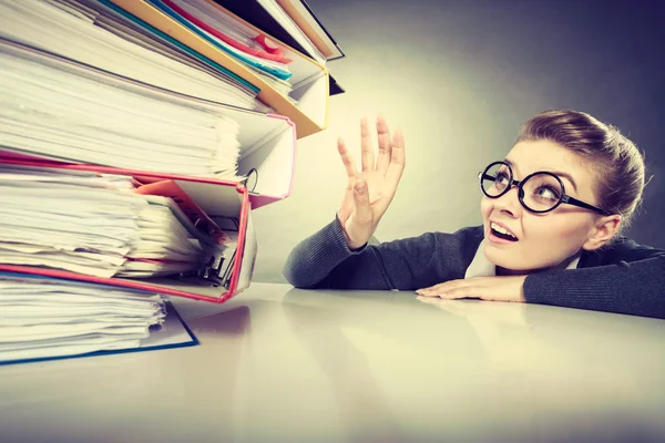 Accountant terrified of pils of binders. — Stock Photo, Image