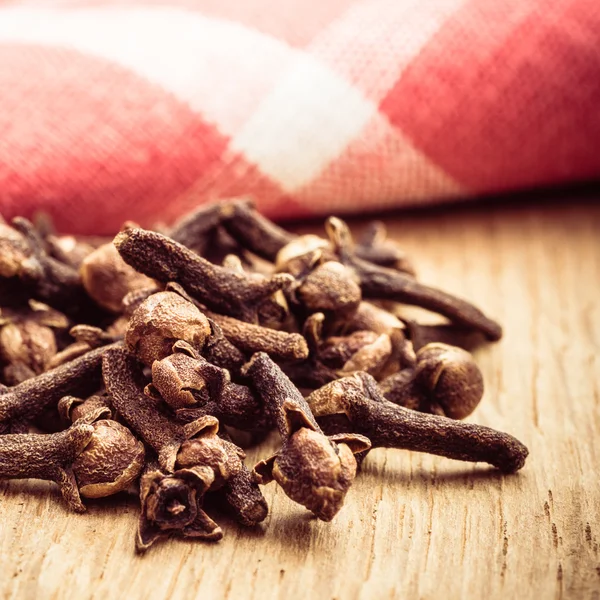 Spice cloves on kitchen table Stock Image