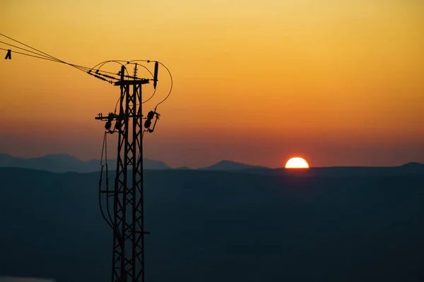 Coast Electricity Transmission Pylons Power Lines High Voltage Towers Sunset — Stock Photo, Image