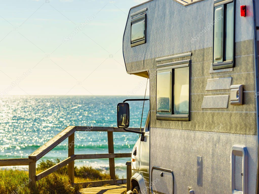 Camper vehicle rv camping on beach sea shore. Spain Murcia region, Calblanque Regional Park.