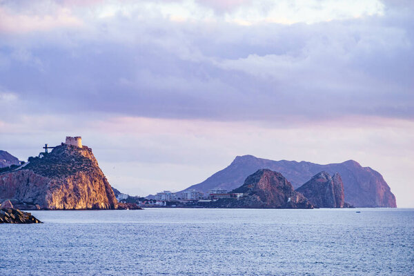 Spanish coastal landscpae with castle San Juan on cliff, Aguilas, Murcia region, Spain.