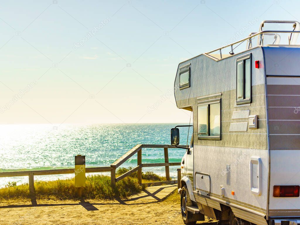 Camper vehicle rv camping on beach sea shore. Spain Murcia region, Calblanque Regional Park.