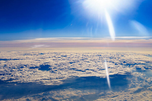 View from airplane window to clouds