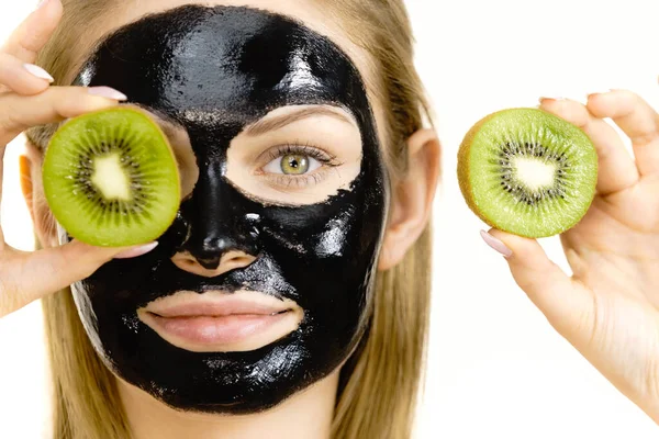 Young Woman Carbo Black Peel Mask Her Face Holding Kiwi — Stock Photo, Image