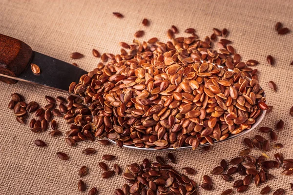 Flax seeds linseed on kitchen spoon — Stock Photo, Image