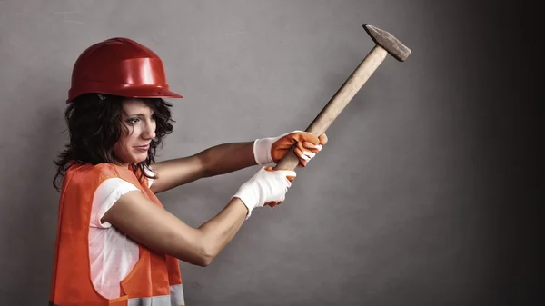 Sexy girl in safety helmet holding hammer tool — Stock Photo, Image