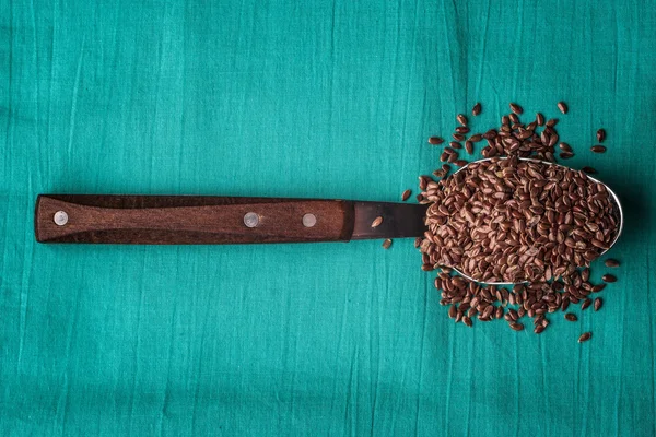 Flax seeds linseed on kitchen spoon — Stock Photo, Image