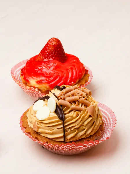 Sweet food two cupcakes on table — Stock Photo, Image