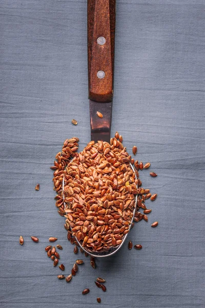 Flax seeds linseed on kitchen spoon — Stock Photo, Image