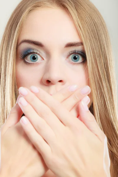 Amazed woman covering her mouth with hands — Stock Photo, Image