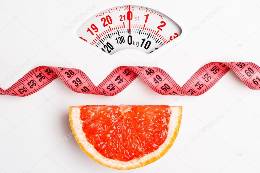 Grapefruit slice with measuring tape