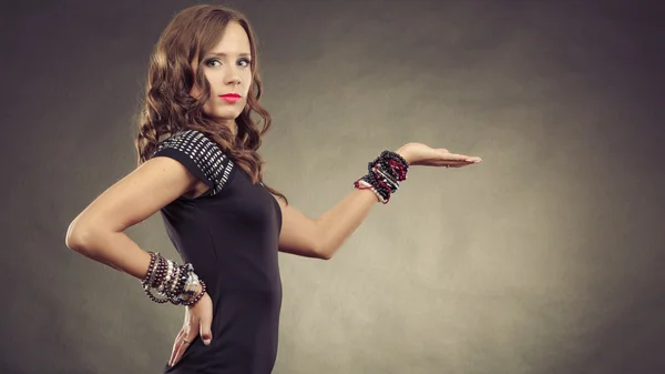 Elegant woman holds open hand — Stock Photo, Image