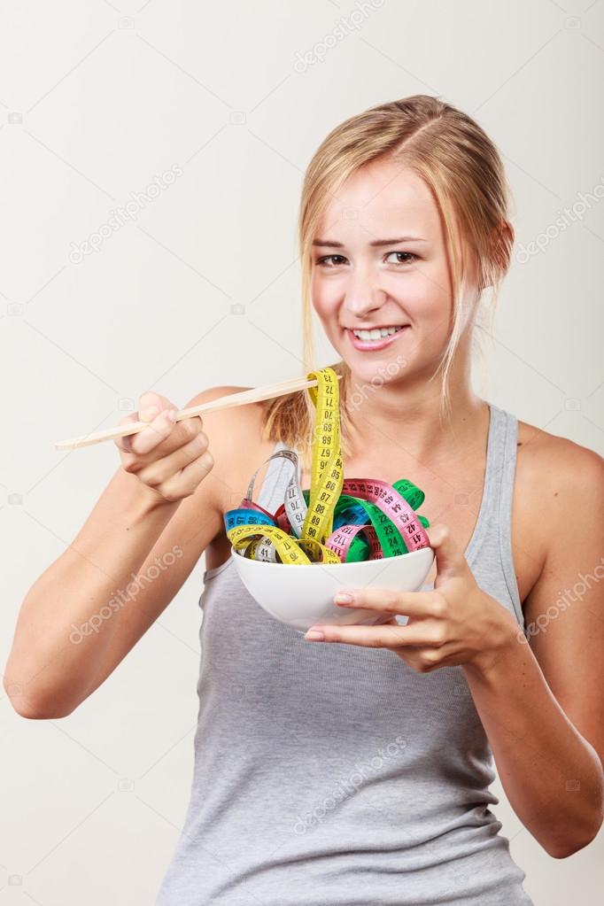 Girl with colorful measuring tapes