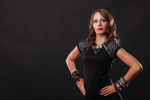 Woman with jewellery in black evening dress — Stock Photo, Image