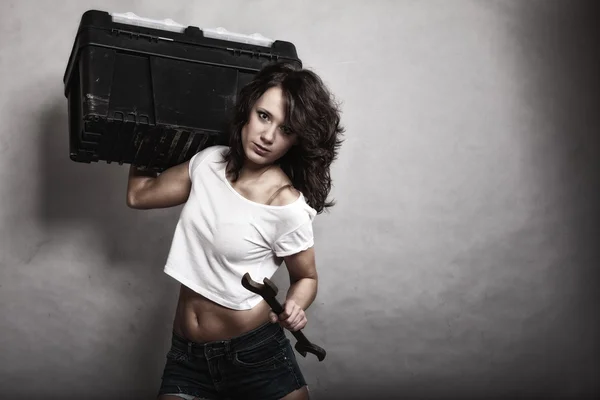 Sexy girl holding toolbox and wrench spanner — Stock Photo, Image