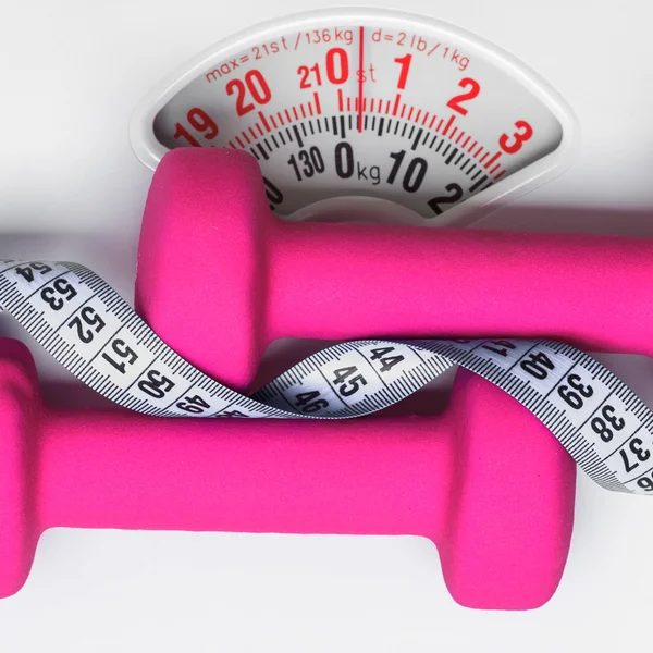 Dumbbell measuring tape on weight scale. Fitness — Stock Photo, Image
