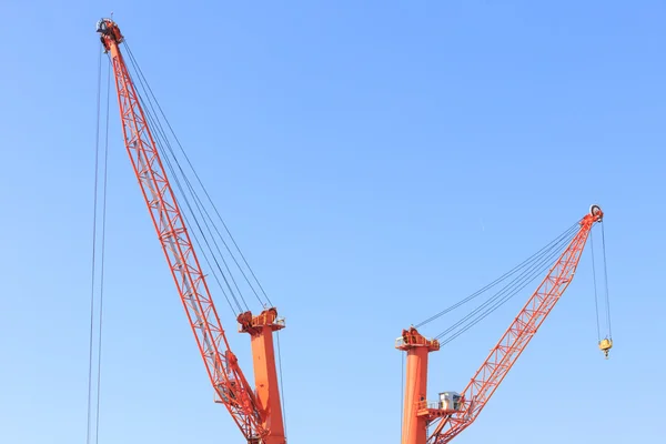 Cranes at port area and blue sky — Stock Photo, Image