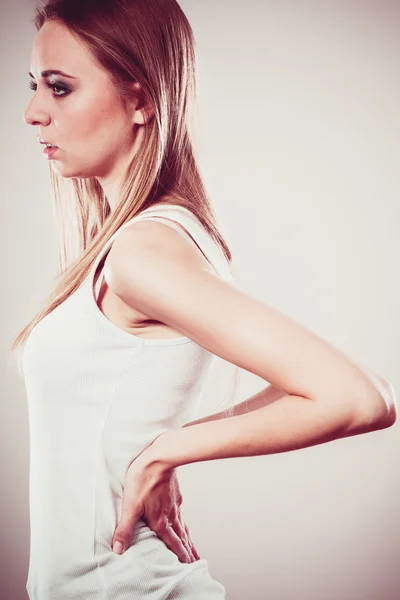 Backache. Young woman suffering from back pain — Stock Photo, Image