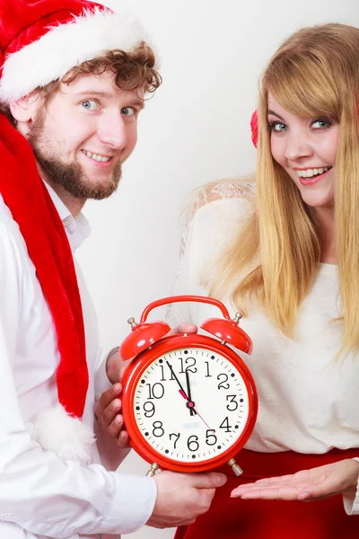 Happy couple woman and man with alarm clock. — Stock Photo, Image