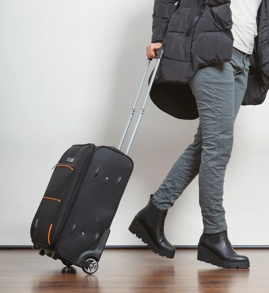 Woman in warm jacket with suitcase. — Stock Photo, Image