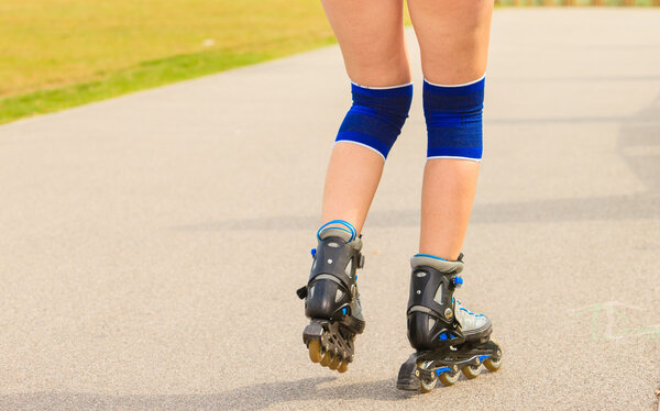 Young woman rollerblading outdoor on sunny day