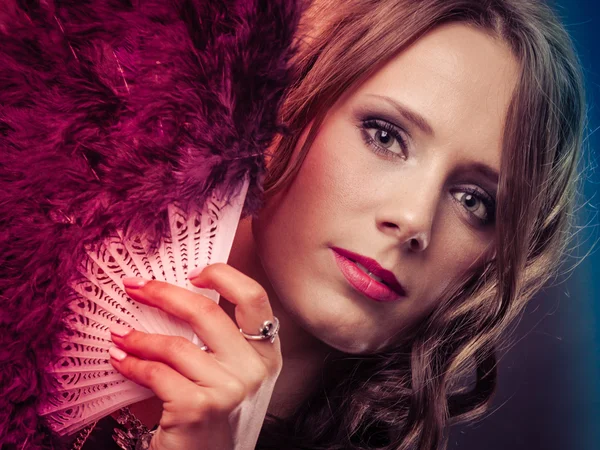 Beautiful brunette woman with black fan in hand — Stock Photo, Image