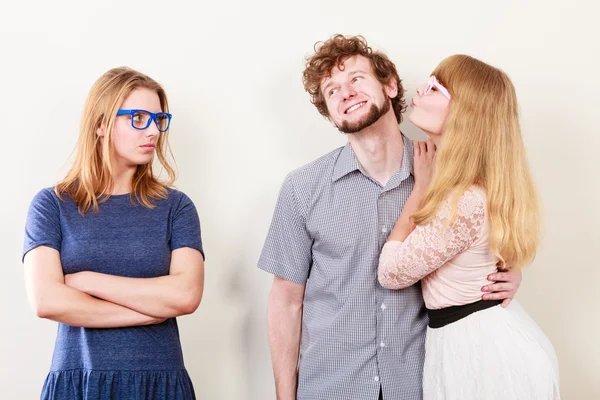 Jealous woman with happy couple — Stock Photo, Image