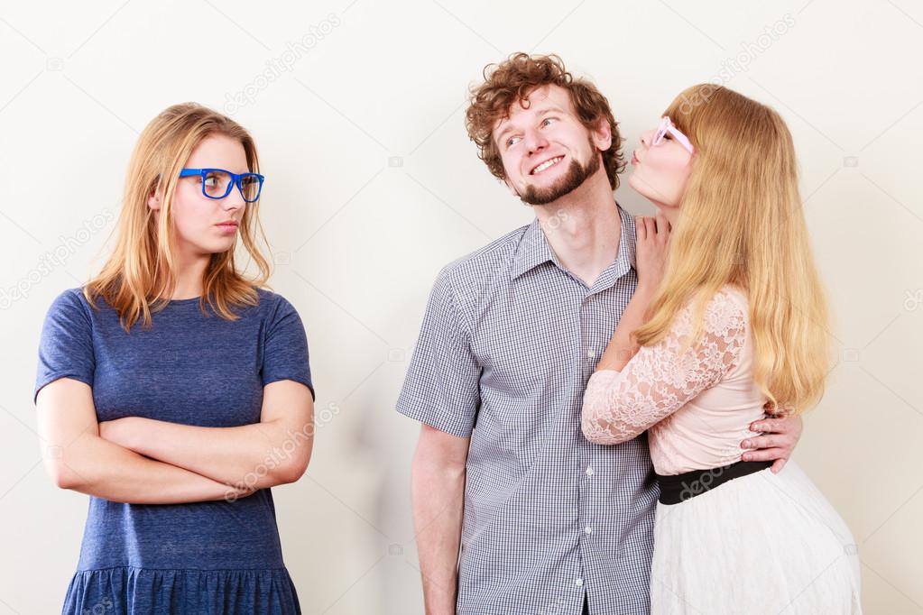 Jealous woman with happy couple