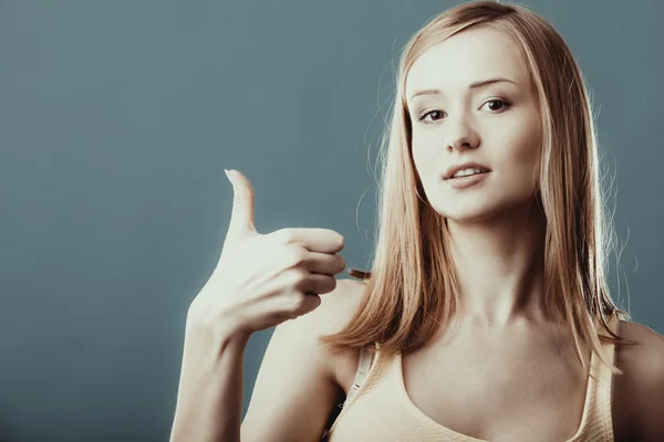 Woman showing thumb up hand sign gesture — Stock Photo, Image