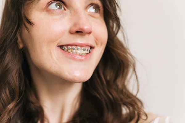 young woman smiling with braces